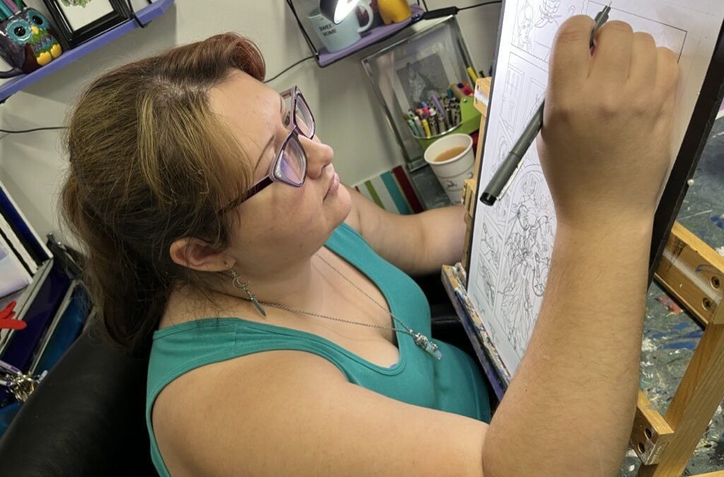 Artist Audra Balion works on a comic.